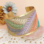 Decorative bracelet with embroidered patterns on a textured surface with flowers in the background