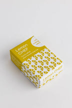 Yellow and white box of Lemon Chef soap on a light gray background