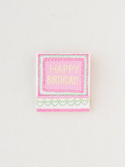 Close up of the matchbook closed, showing the front that says, "Happy Birthday".