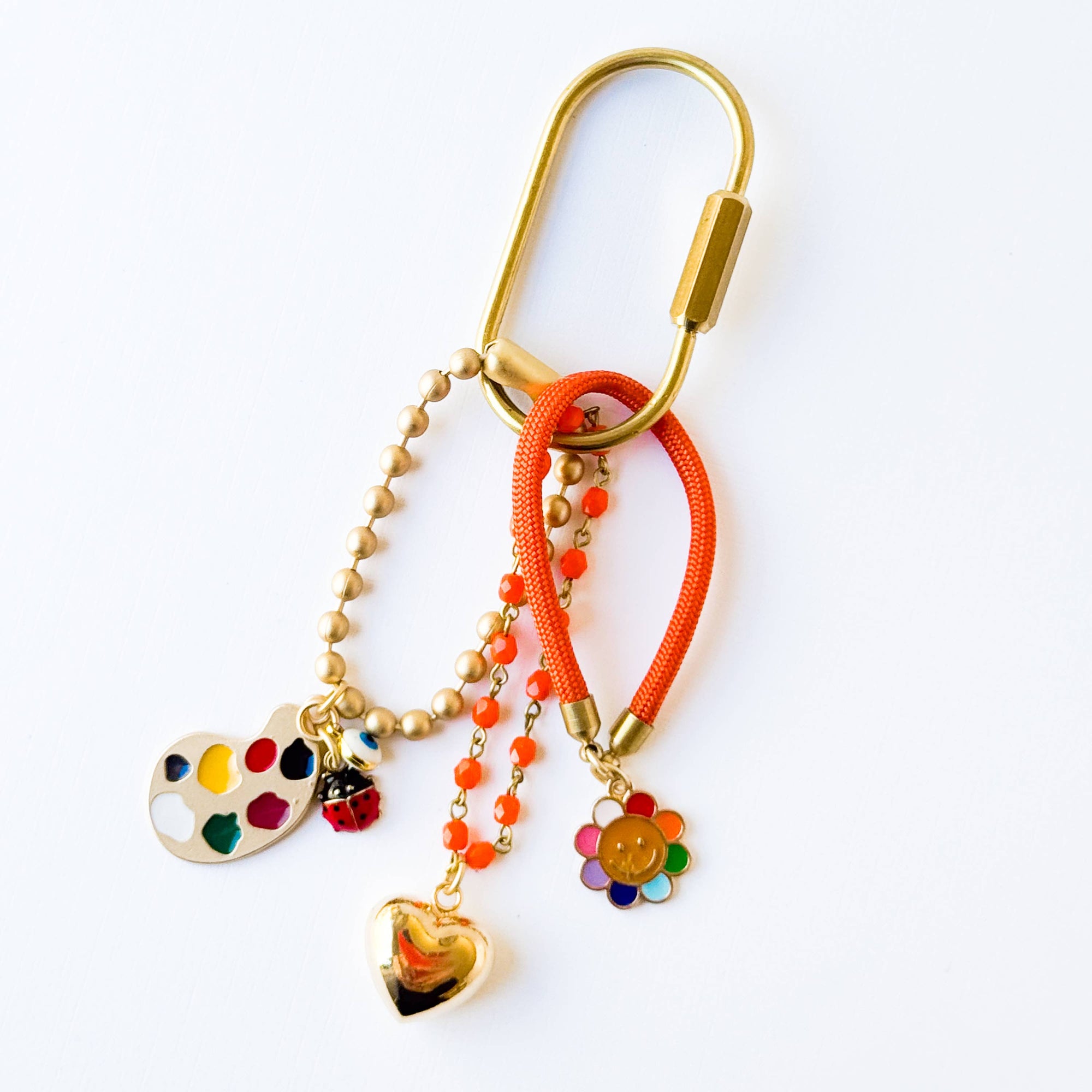 Bright and cheerful keychain showing fun and cheerful charms