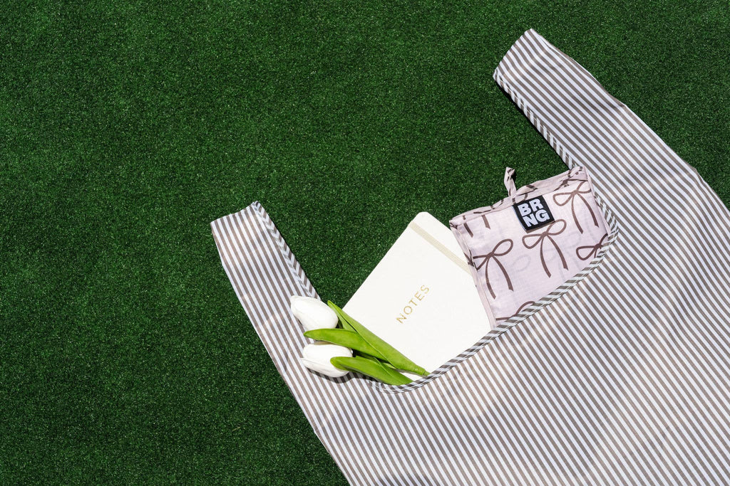 A black and white striped foldable tote made from durable ripstop nylon, perfect for groceries and errands.