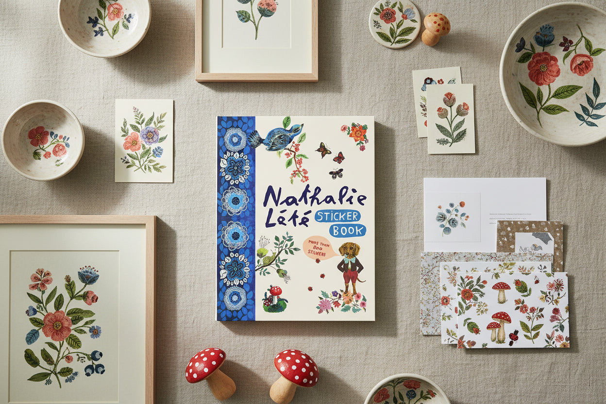 Sticker book cover with colorful illustrations of nature and a dog, featuring the brand 'Nathalie Léte'.
