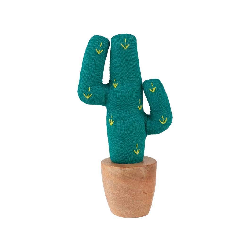 Miniature cotton saguaro cactus with clay-toned base on desk