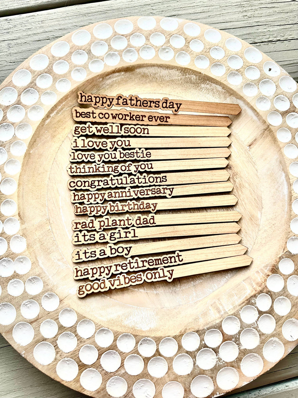 Set of engraved cherry hardwood plant sticks with heartfelt messages.