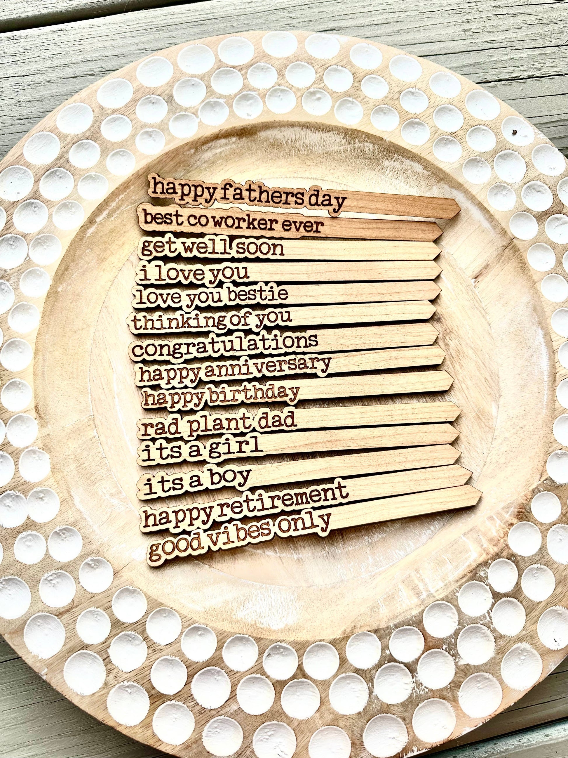 Set of engraved cherry hardwood plant sticks with heartfelt messages.