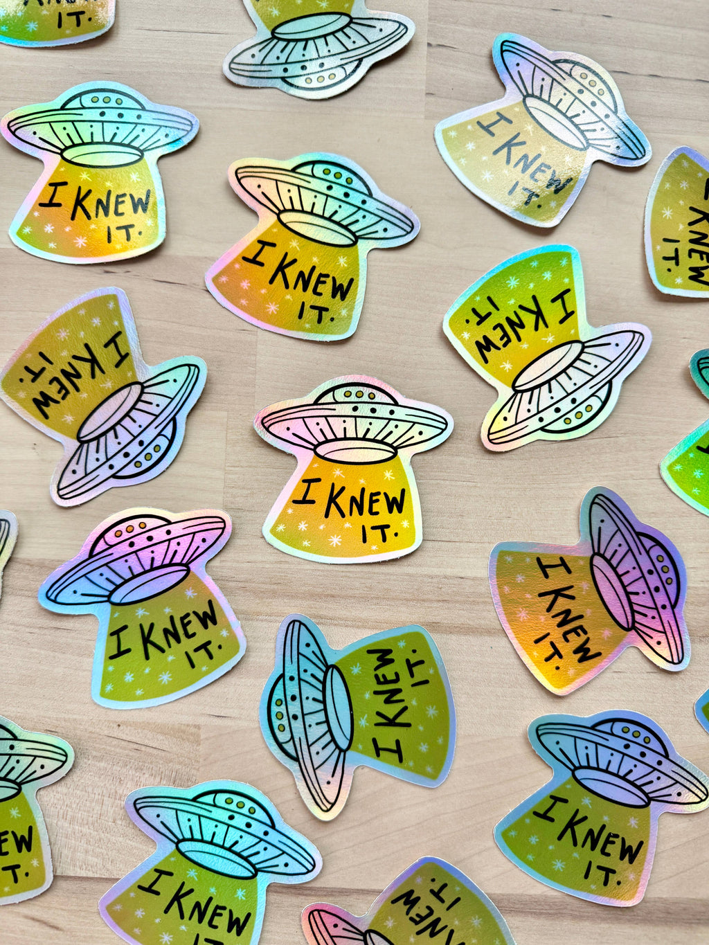 UFO vinyl sticker with 'I Knew It' text on starry background