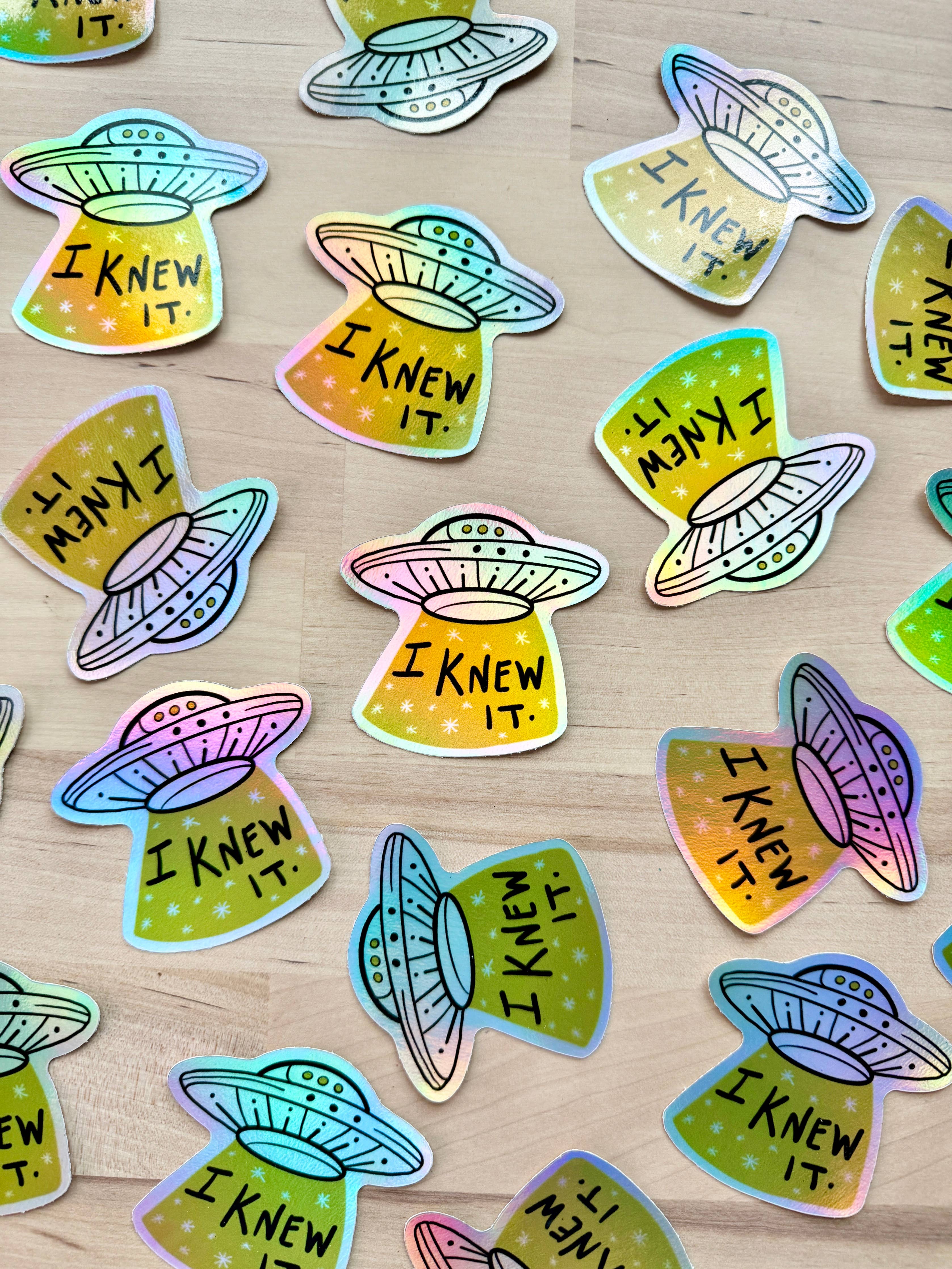 UFO vinyl sticker with 'I Knew It' text on starry background