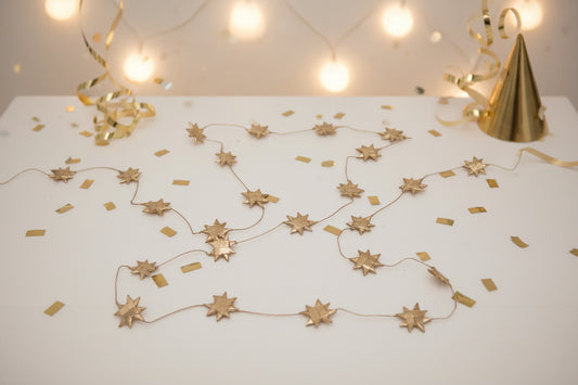 Star-shaped string lights on a white background