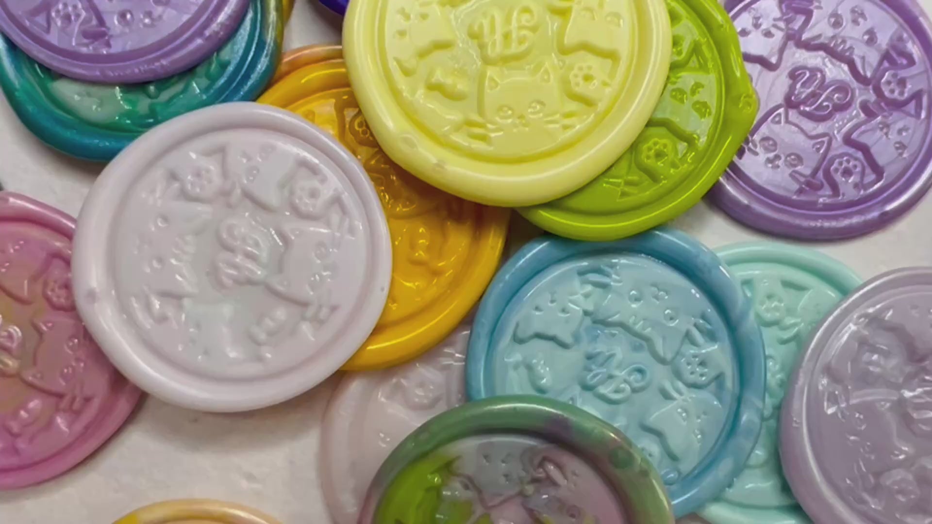 Video of the Hi Kitty Wax Seal Stickers in various colors on natural handmade paper