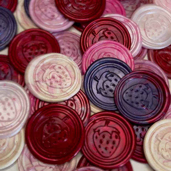 Whimsical wax seal featuring a bright berry design to sweeten any project.
