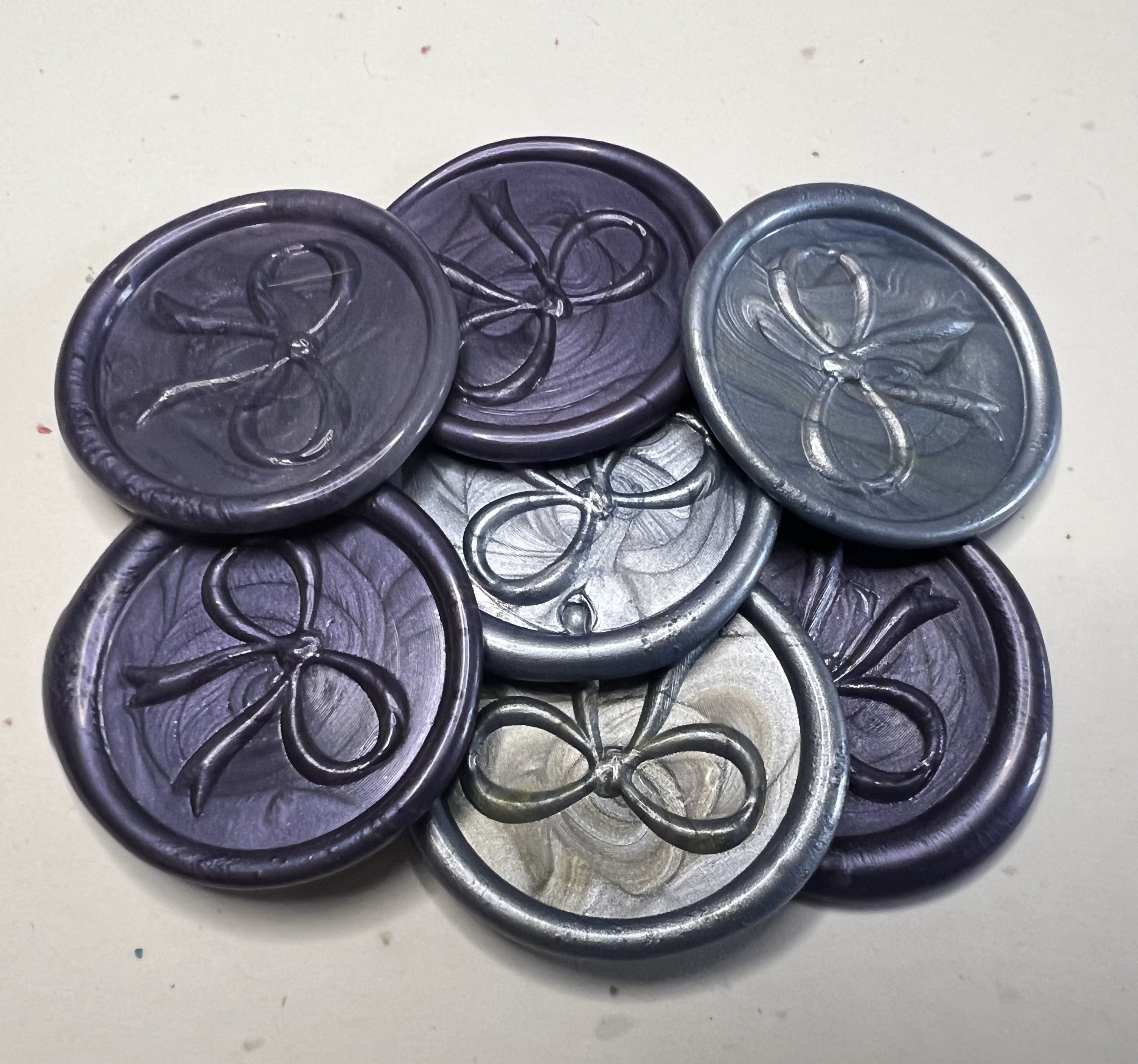 Delicate purple bow wax seal tags, ideal for wrapping gifts for birthdays, anniversaries, and seasonal events.