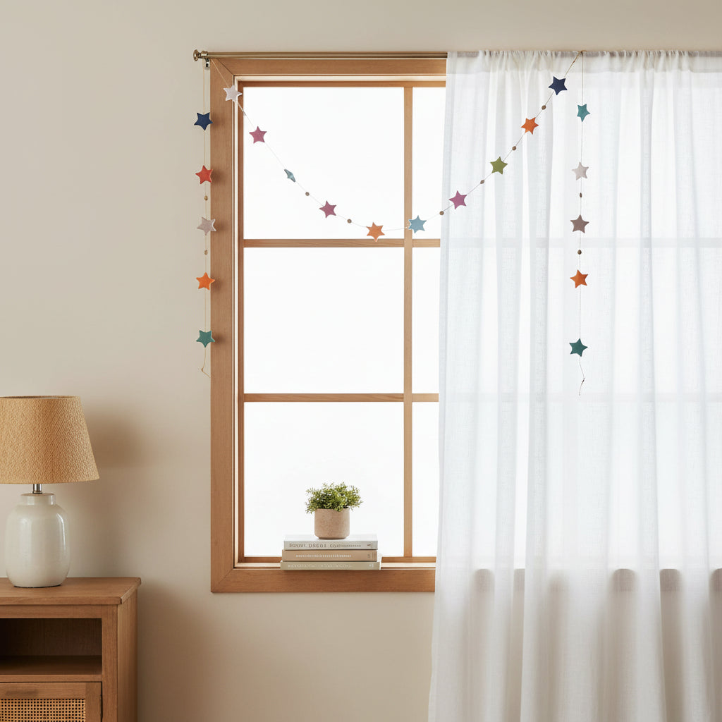 String of colorful paper star-shape garland on a white background